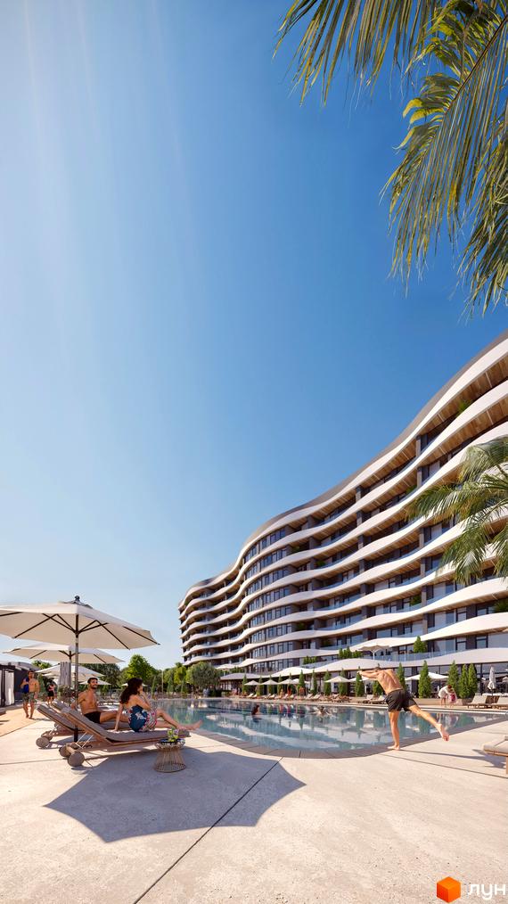 Житловий комплекс Sky River 2 з хвилястим фасадом та басейном з відпочиваючими на шезлонгах. Сучасна архітектура та зона відпочинку біля води.