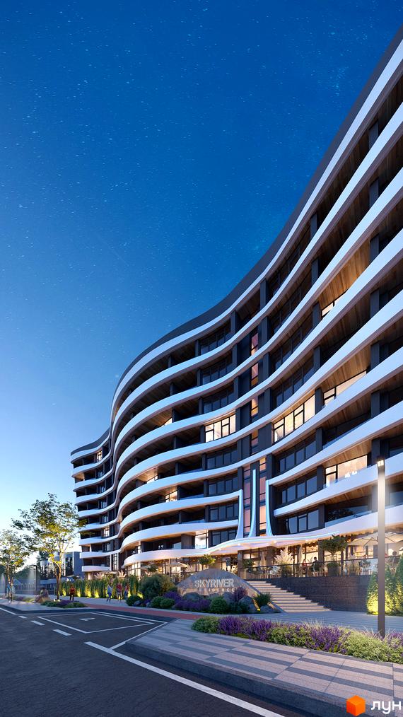 Зовнішній вигляд житлового комплексу Sky River 2 з хвилястим фасадом та заскленими балконами. Навколо будинку облаштована прибудинкова територія з ландшафтним дизайном та пішохідними доріжками.