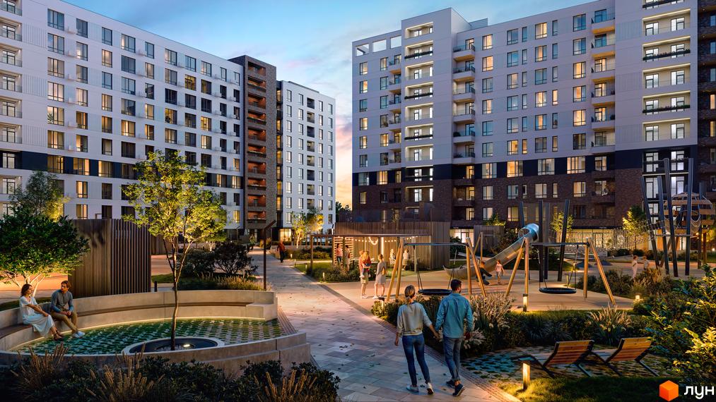Житловий комплекс Premier Bay з сучасним фасадом та доглянутою прибудинковою територією з дитячим майданчиком та зонами відпочинку.