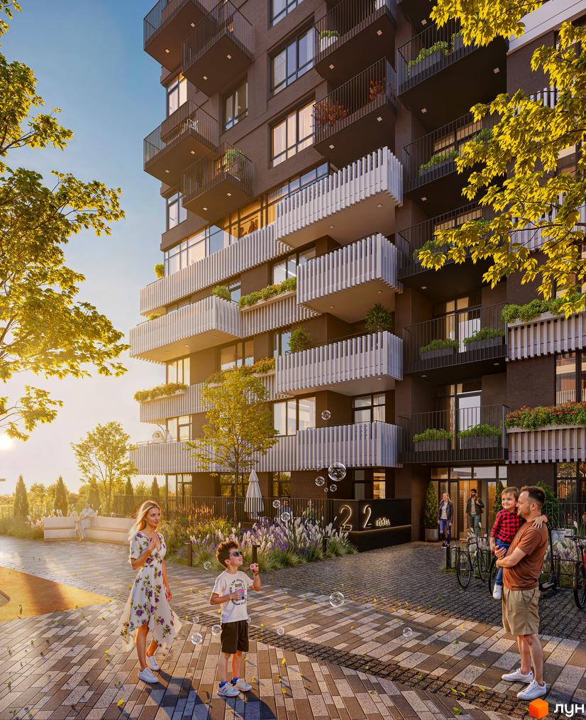 Будинок ЖК TWINS з балконами та зеленню. Прибудинкова територія з сім'єю та бульбашками.