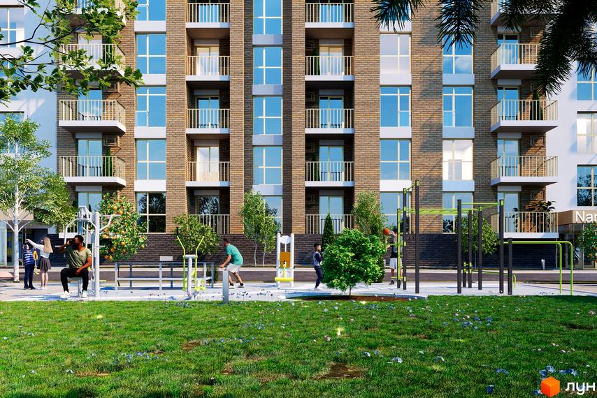 Житловий комплекс Кориця: цегляний будинок з балконами та вікнами, поруч спортивний майданчик та зелена зона.