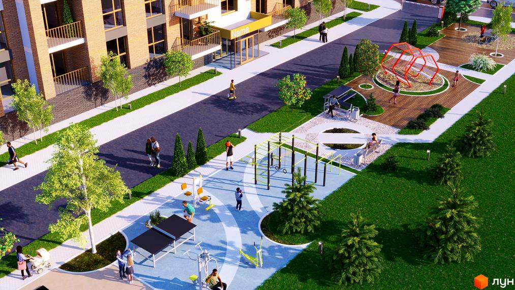 Житловий комплекс Кориця: цегляний будинок з балконами та прибудинковою територією з дитячим майданчиком та зонами відпочинку.