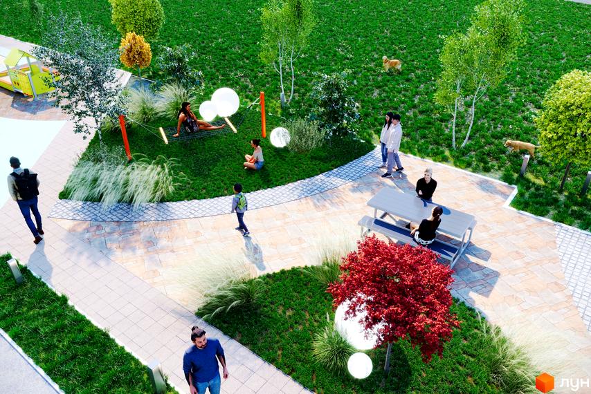 Житловий комплекс Кориця: зона відпочинку з гамаком, лавкою та деревами. Люди відпочивають на зеленій території біля новобудови.