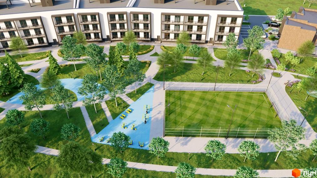 Житловий комплекс PARK AVENUE: фасади будинків та зелена прибудинкова територія з дитячими майданчиками та спортивним полем.