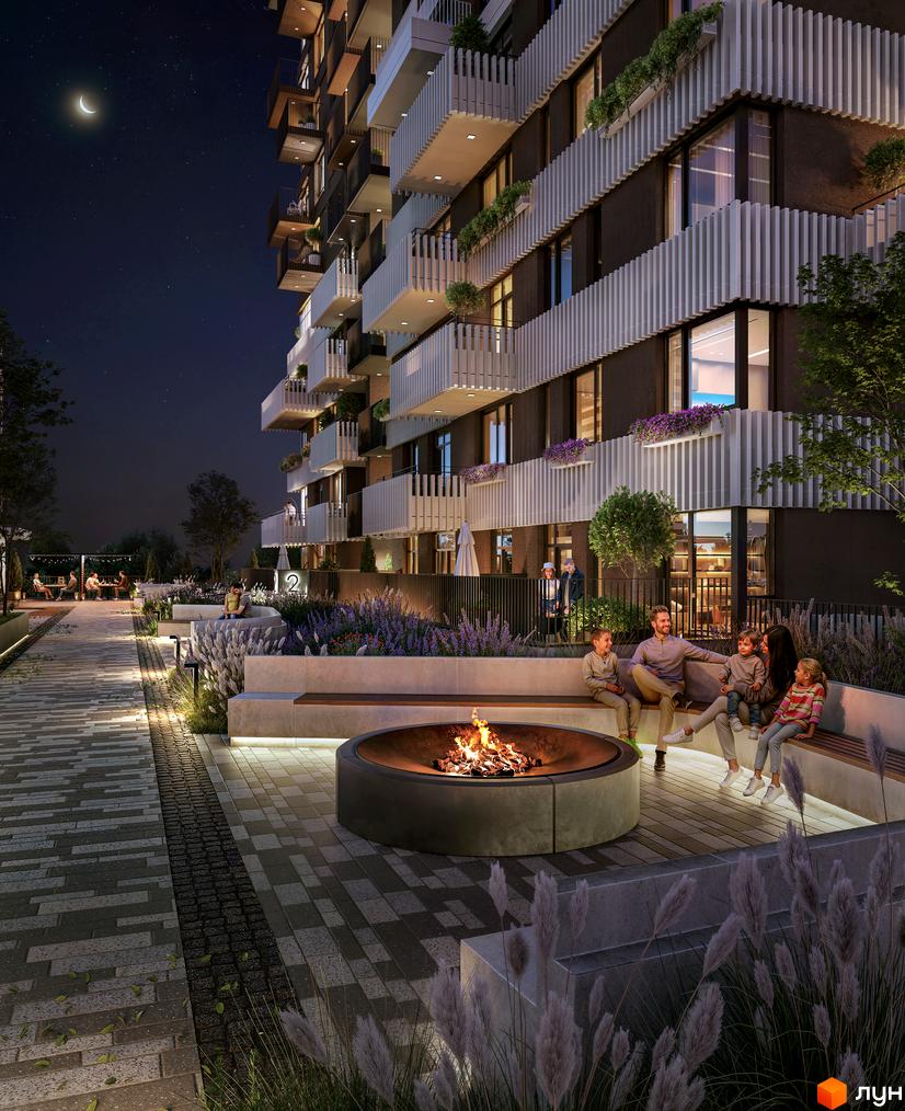 Житловий комплекс TWINS з балконами та вікнами, що виходять на нічне небо. Прибудинкова територія з місцем для відпочинку біля вогнища.