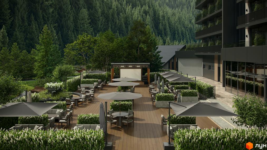 Зовнішній вигляд новобудови Green Rest з терасою та зоною відпочинку біля лісу. На території розташовані столики, крісла та парасольки під відкритим небом.