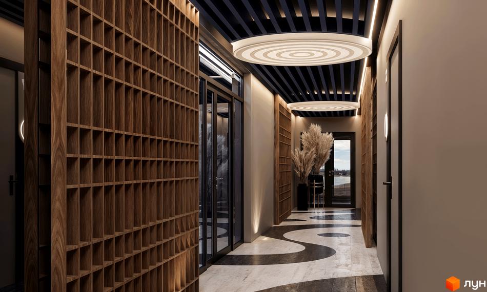 Інтер'єр холу житлового комплексу CONTINENT RIVER PARK з дерев'яними панелями та дизайнерською підлогою. Простір освітлений сучасними світильниками.