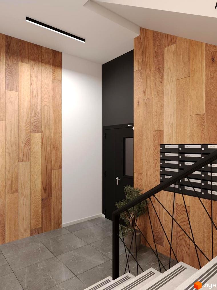 Інтер'єр під'їзду житлового комплексу Кришталь з дерев'яними панелями та поштовими скриньками. Сучасний дизайн вхідної групи новобудови.