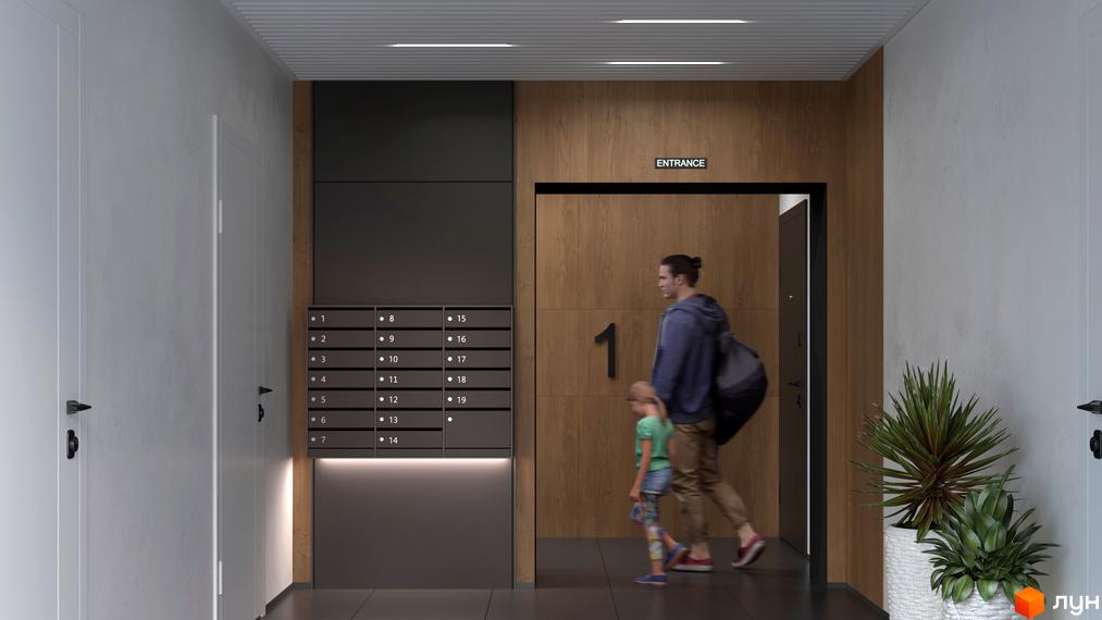 Сучасний вхід до житлового комплексу Біла Сакура з поштовими скриньками та дверима. Біля входу стоять рослини в горщиках.