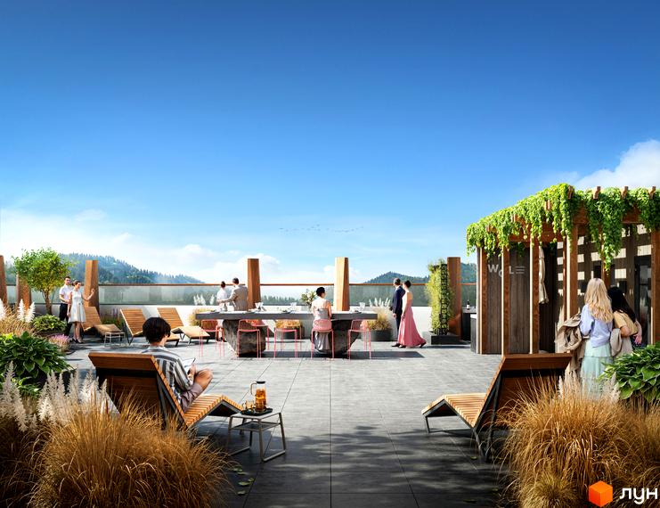 Тераса житлового комплексу WOL. Home. Karpaty з відпочинковою зоною та зеленими насадженнями на тлі гірського пейзажу.