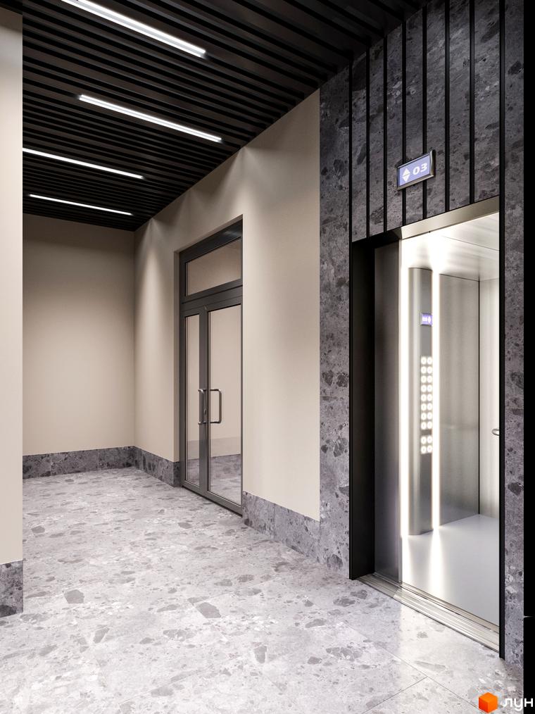 Сучасний хол з ліфтом та скляними дверима в житловому комплексі Євромісто 2. Підлога оздоблена плиткою з мармуровим ефектом.