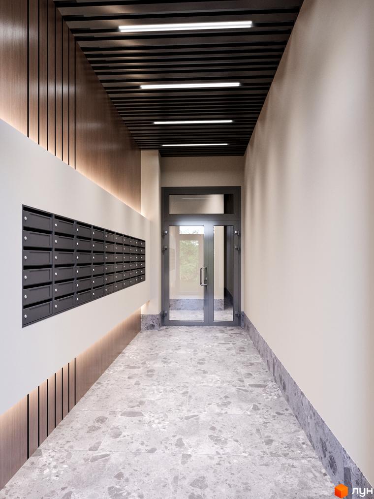 Вхідна група в житловий комплекс Євромісто 2 з поштовими скриньками та дверима. Сучасний дизайн коридору з дерев'яними панелями та підсвіткою.