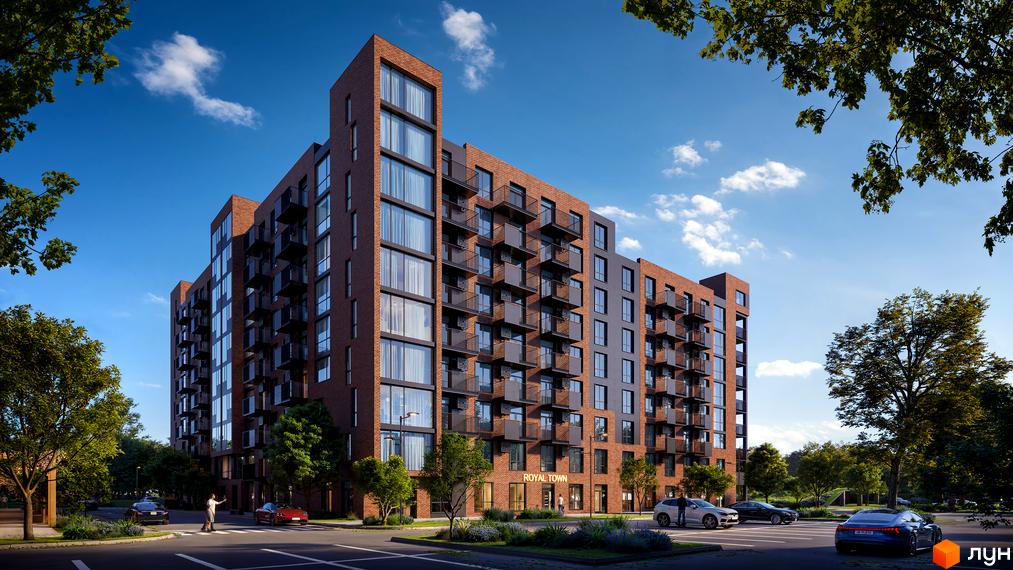 Житловий комплекс Royal Town з цегляним фасадом та балконами, розташований біля дороги з деревами та автомобілями.