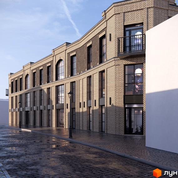 Фасад житлового комплексу Замковий з цегляною кладкою та великими вікнами. Мокрий бруківкою перед будинком.