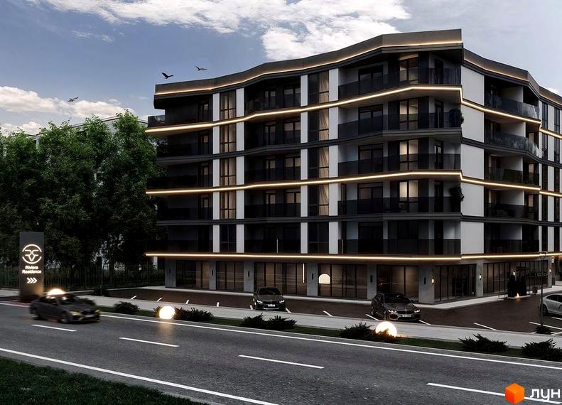 Житловий комплекс Riviera Residence з вигнутим фасадом та підсвіткою. Перед комплексом дорога з автомобілями та освітленням.
