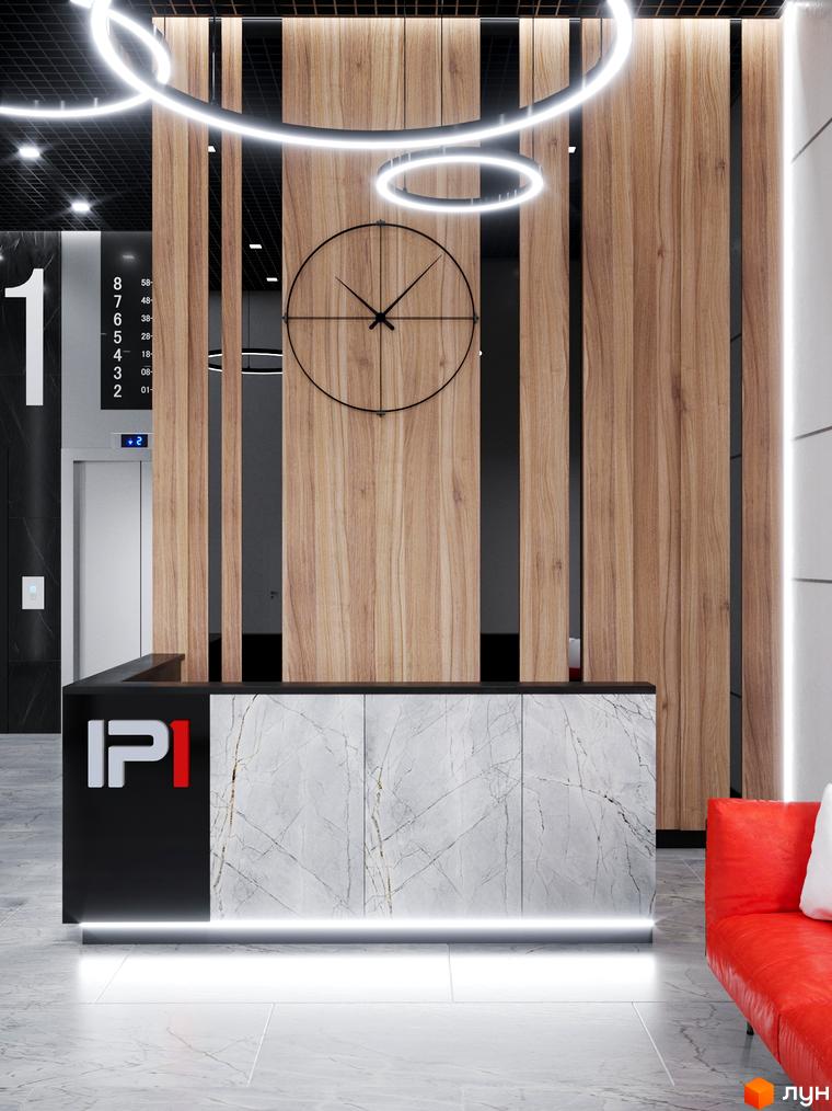 Житловий комплекс IP1: сучасний дизайн рецепції з мармуровою стійкою та дерев'яними панелями. Поруч розташована червона зона відпочинку.