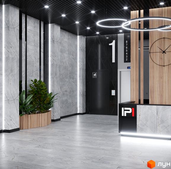 Сучасний хол житлового комплексу IP1 з мармуровими колонами, рослинами та годинником на стіні. Елегантний дизайн інтер'єру та комфортна атмосфера для мешканців.