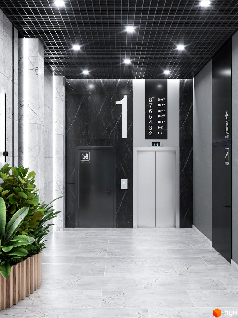 Сучасний інтер'єр холу житлового комплексу IP1 з мармуровим оздобленням та ліфтами. Просторий та світлий простір для мешканців.