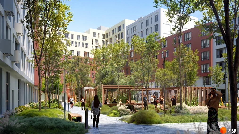 Зовнішній вигляд житлового комплексу Father з різнокольоровими фасадами та зеленою прибудинковою територією. На території розташовані зони відпочинку та дерева.