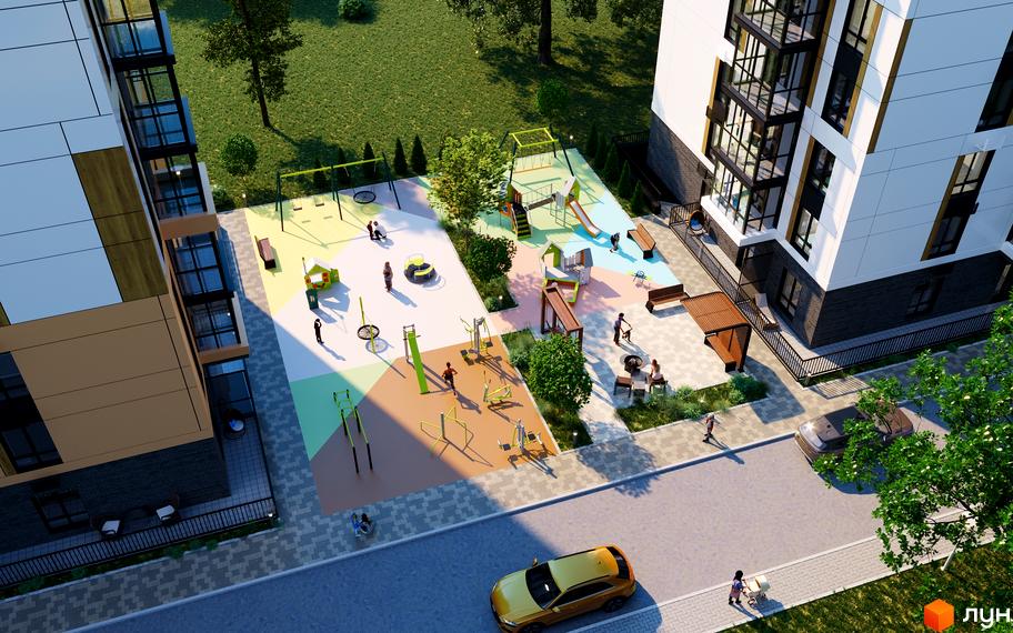 Житловий комплекс Гармонія: фасади будівель з великими вікнами та прибудинкова територія з дитячим майданчиком та зонами відпочинку.