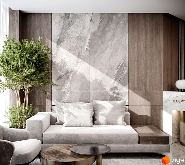 Інтер'єр вітальні ЖК Резиденція Бойківська з диваном, кріслом та деревом у горщику. Дизайн виконаний у сірих тонах з акцентами на натуральні матеріали.