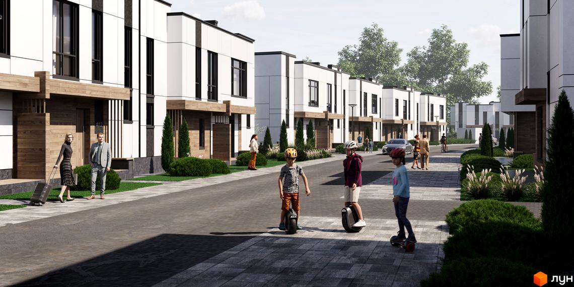 Зовнішній вигляд котеджного містечка КМ Kolibri з білими фасадами та дерев'яними елементами, доглянута прибудинкова територія з доріжками та зеленими насадженнями.