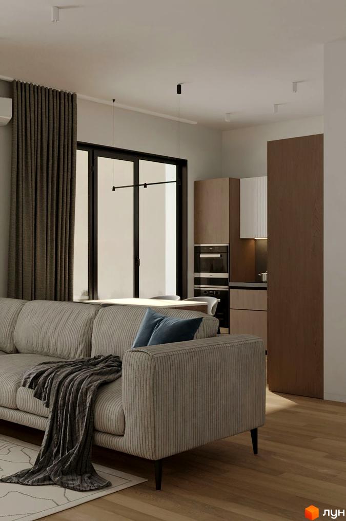 Інтер'єр квартири в ЖК Kolibri: затишна вітальня з диваном та пледом, кухня з дерев'яними фасадами та вбудованою технікою. Сучасний дизайн та функціональне планування.