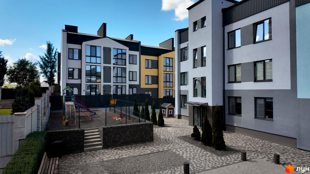 Житловий комплекс Вілла Італія: фасади будівель з панорамними вікнами та дитячий майданчик з гірками та гойдалками.