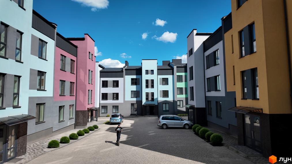 Житловий комплекс Вілла Італія. Зовнішній вигляд будівель з різнокольоровими фасадами та прибудинкова територія з автомобілями та пішоходом на електросамокаті.