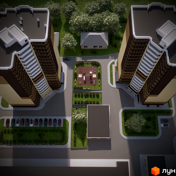 Вид зверху на житловий комплекс з двома висотними будинками та дитячим майданчиком між ними, а також парковкою та зеленими зонами.