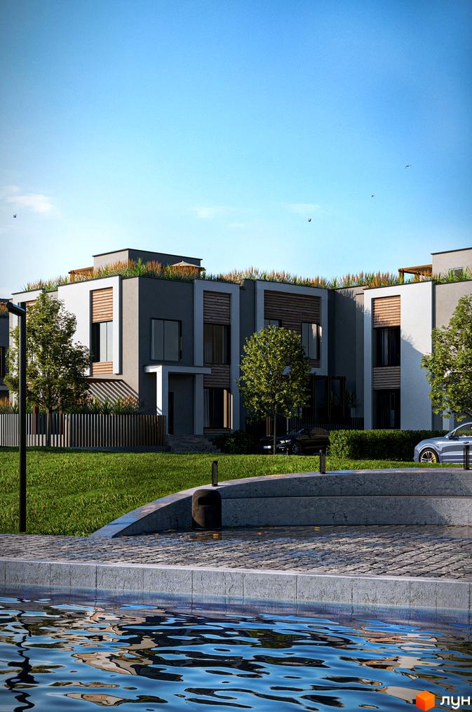 Зовнішній вигляд будинків КМ The Lake з зеленими дахами та прибудинковою територією з газоном і водоймою. Сучасний житловий комплекс біля озера.