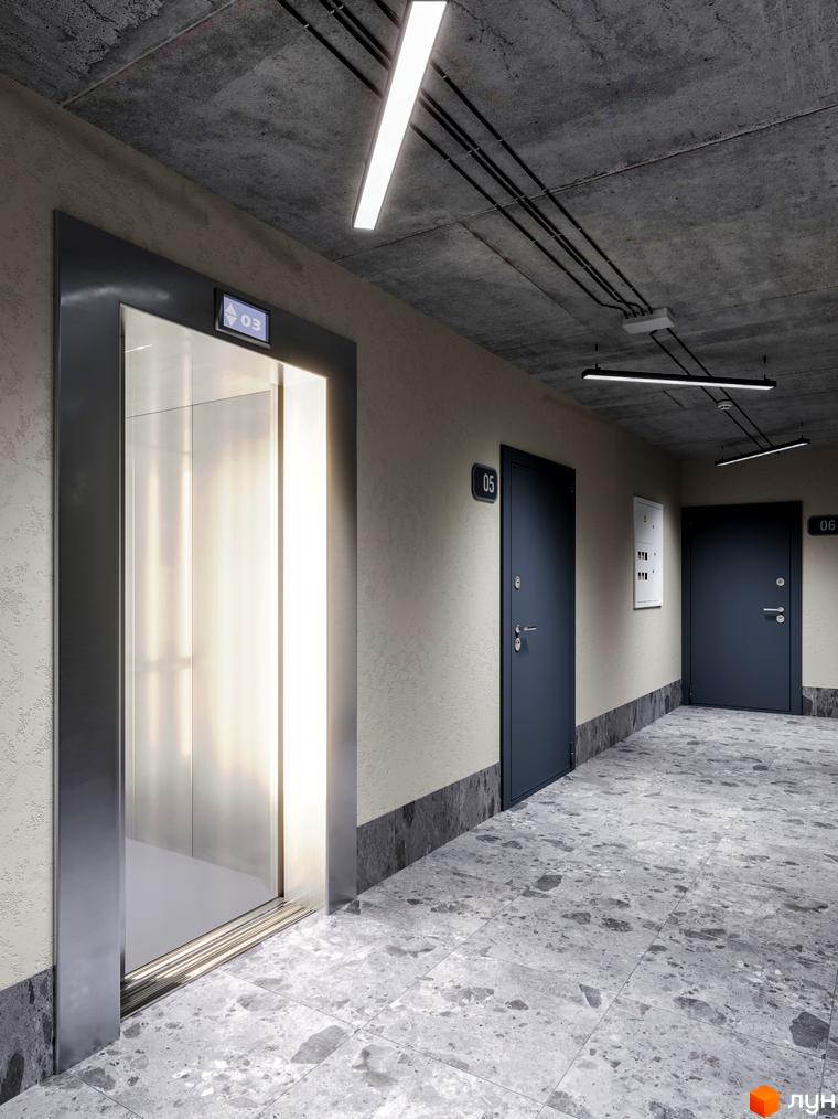 Сучасний коридор з дверима та ліфтом у житловому комплексі Євромісто 2. Підлога оздоблена плиткою з мармуровим ефектом.