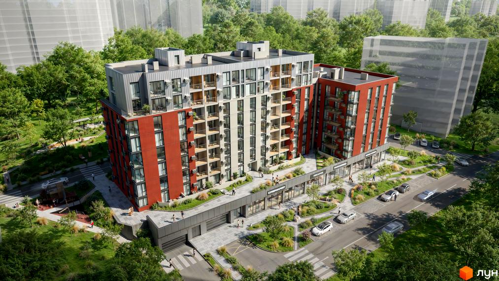 Зовнішній вигляд будинку ЖК SVOÏ INSPIRO з червоними та сірими фасадами, численними балконами та прибудинковою територією з зеленими насадженнями та місцями для відпочинку.