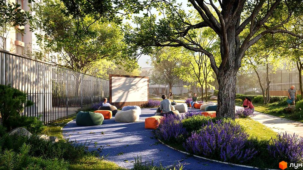 Житловий комплекс Sister: зона відпочинку з біоморфними пуфами та екраном для кінопоказу під відкритим небом. Навколо зелені насадження та квітучі рослини.
