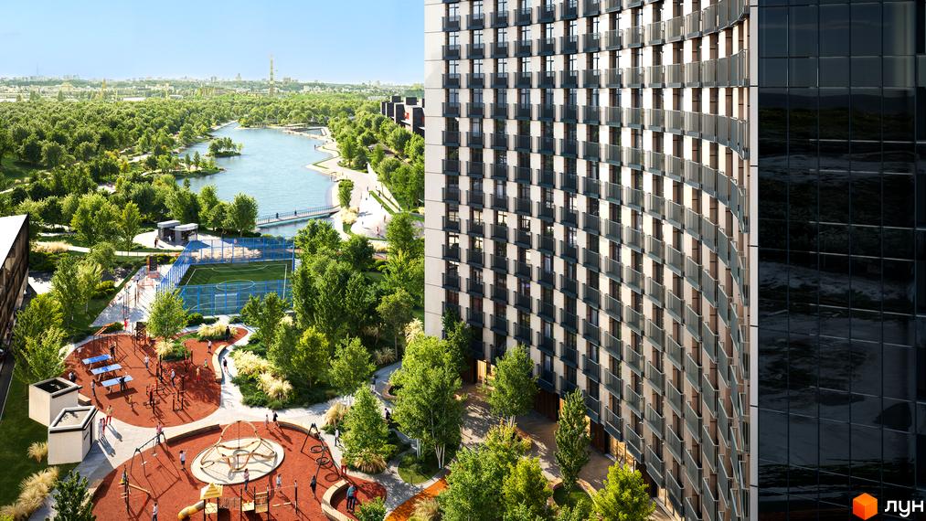 Житловий комплекс BEREG Residence з вигнутим фасадом та балконами, поруч спортивний майданчик, дитячі зони та озеро.