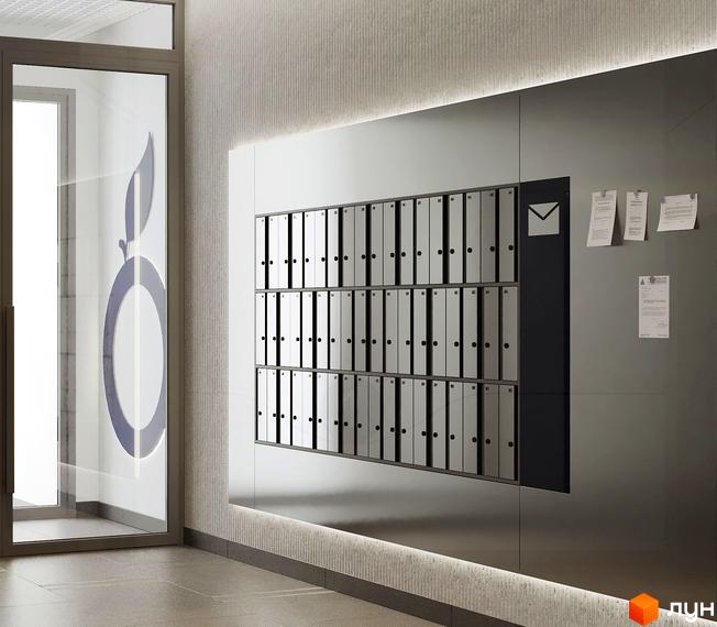 Новобудова Newton з сучасними поштовими скриньками та логотипом яблука на склі.