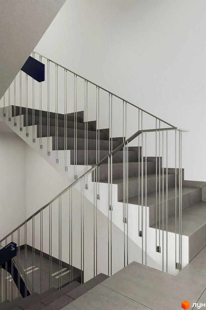 Сучасні сходи в ЖК Newton з сірими сходами та металевими поручнями. Зовнішній вигляд новобудови.