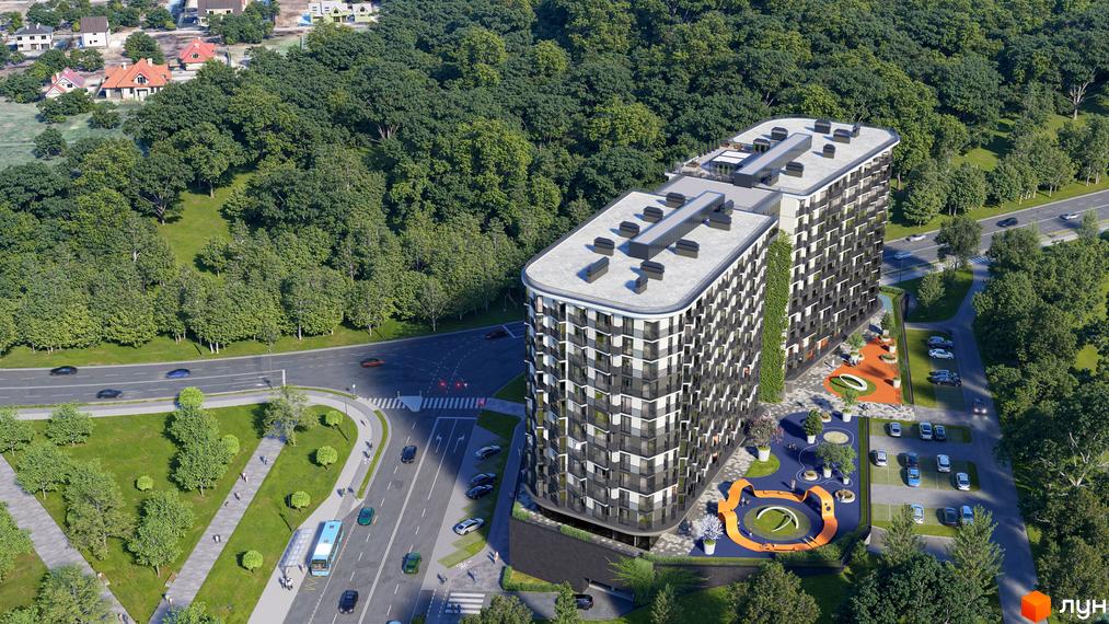 Зовнішній вигляд двосекційного житлового комплексу з панорамними вікнами та балконами, розташованого поруч із зеленим парком та дорогою. Прибудинкова територія включає дитячий майданчик та парковку.