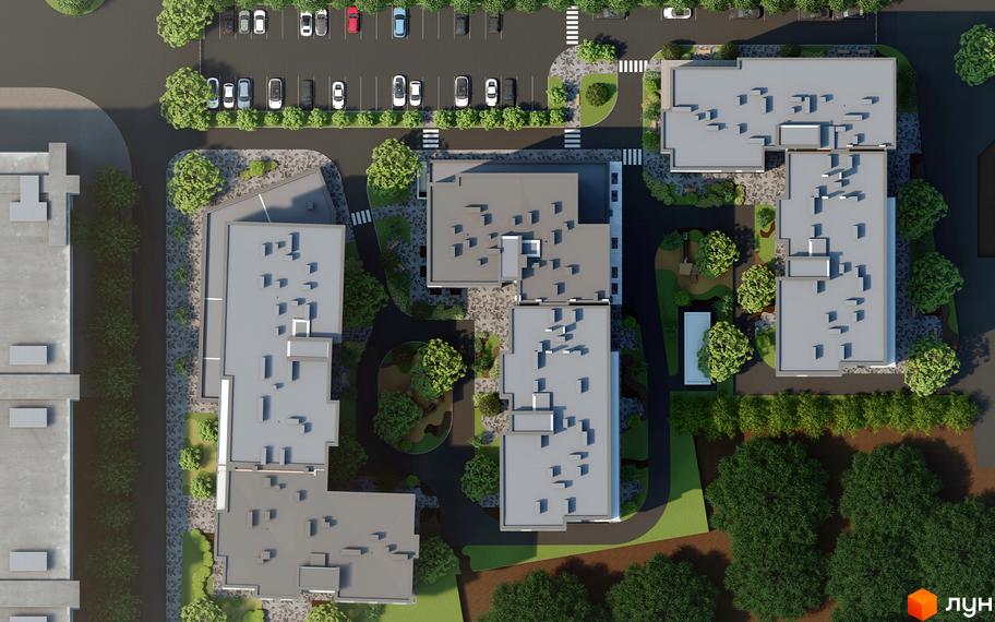 Аерофотозйомка житлового комплексу Гармонія з кількома будинками та парковкою. Навколо будівель розташовані зелені насадження та зони відпочинку.