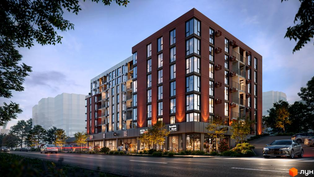 Новобудова SVOÏ INSPIRO з червоною цегляною фасадною частиною та великими вікнами, розташована біля дороги з автомобілями та зеленими деревами.