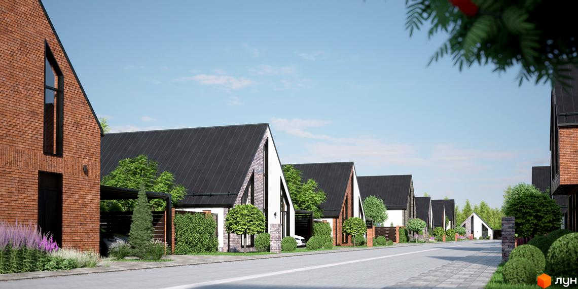 Котеджне містечко ArtHomes: фасади будинків з червоної цегли та білої штукатурки, чорні дахи, доглянуті зелені насадження та брукована дорога.