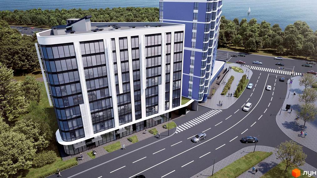 Зовнішній вигляд житлового комплексу Канкріт з фасадами з скла та білих панелей, розташований біля дороги та зеленої зони.