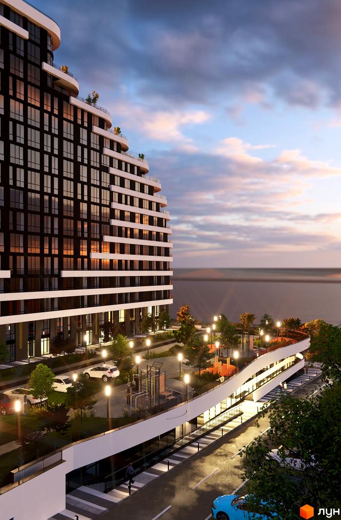 Житловий комплекс SvitLand Residences з фасадом з темних вікон та білих балконів, поруч розташований дитячий майданчик та парковка.