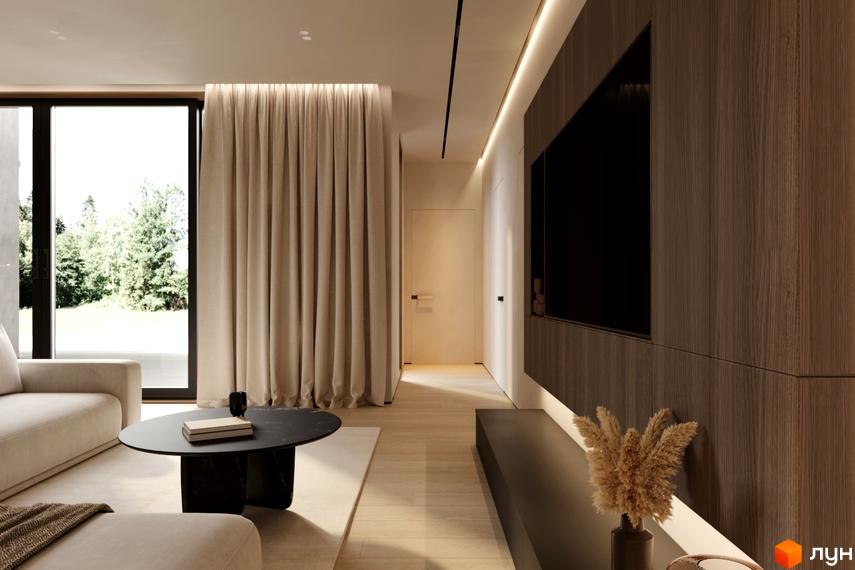 Інтер'єр вітальні в житловому комплексі КМ NOA з великим вікном, кавовим столиком та телевізором на стіні.