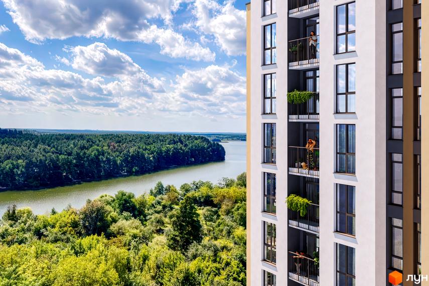 Новобудова ЖК Рівер Сіті з балконами та вікнами, що виходять на зелену зону з річкою та лісом. Вид з висоти пташиного польоту.