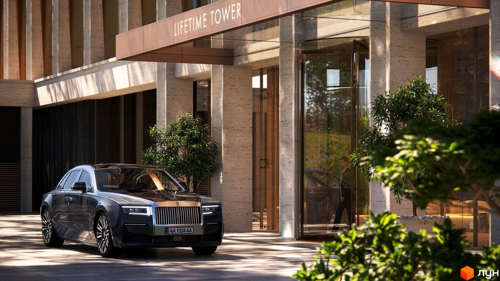 Зовнішній вигляд житлового комплексу THE ONE з елегантною архітектурою та в'їздом, поруч прибудинкова територія з деревами та автомобілем.