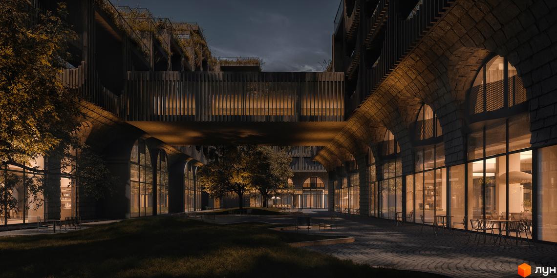 Житловий комплекс Son Daven з кам'яними арками та скляними фасадами, що виходять на внутрішній двір з деревами та зонами відпочинку.