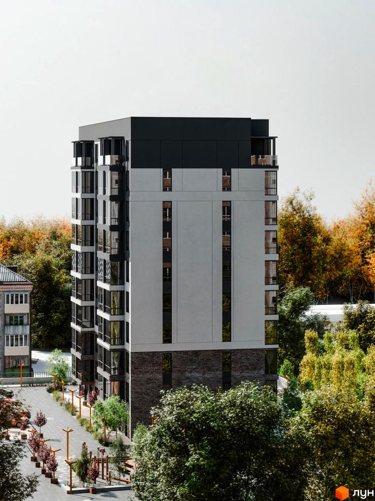 Новобудова ЖК Перемога з сірими фасадами та скляними балконами на тлі осінніх дерев. Поруч розташована прибудинкова територія з доріжками та зеленими насадженнями.