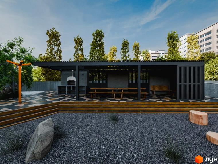 Зона відпочинку з альтанкою, столами та лавками біля новобудови ЖК Перемога. Територія з гравієм та деревами.