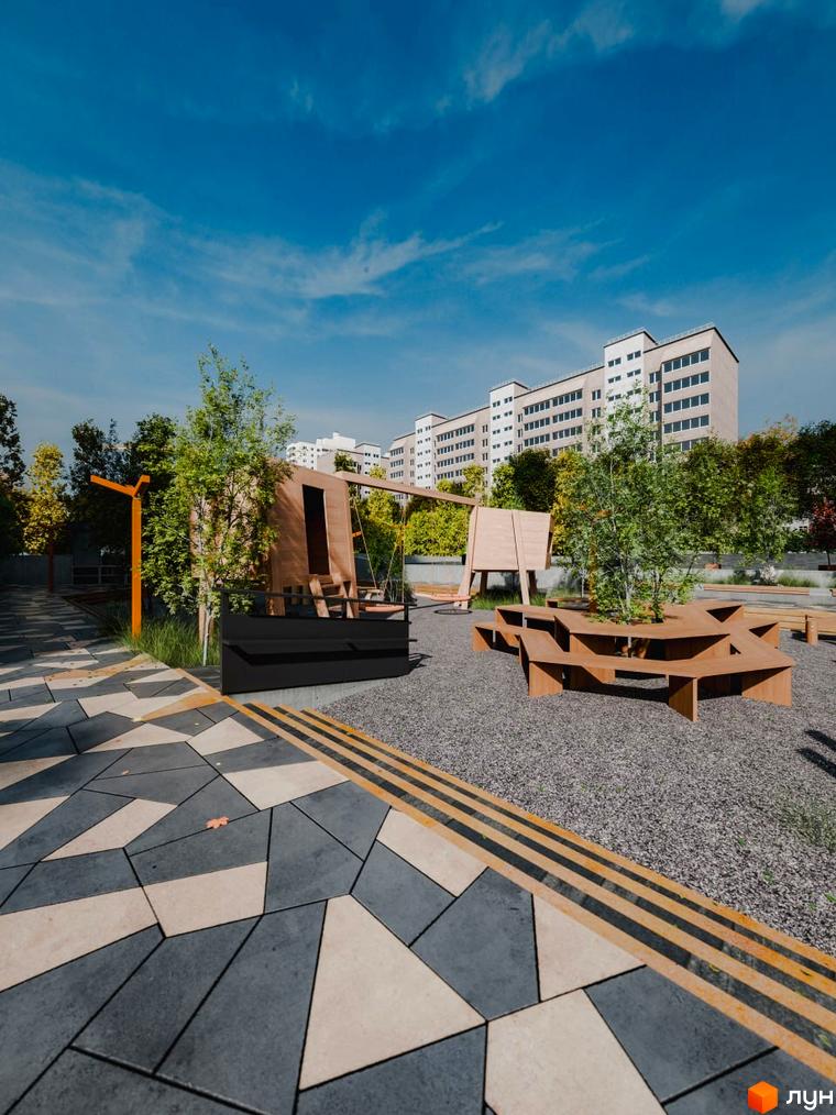 Зовнішній вигляд будинку ЖК Перемога та його прибудинкова територія з дитячим майданчиком та зонами відпочинку.